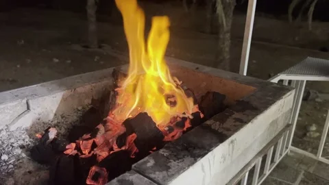 Bright flames burning on charcoal in a barbecue pit Stock Footage 345145456
