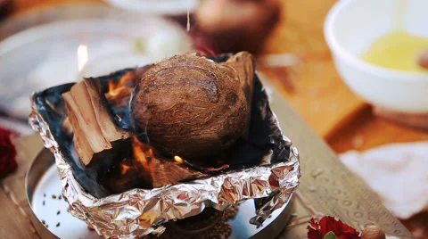 Bright flames envelope cocounut lying on the wood Stock Footage 68668812