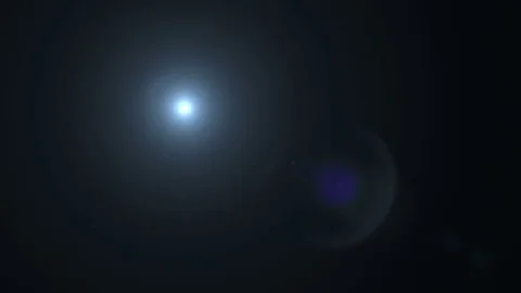 Bright flash, moving particles on a black background. Moving Flare Stock Footage 76208278