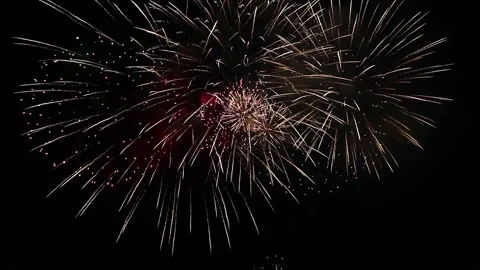 Bright flashes of festive fireworks in the night black sky. Video stock 193594751