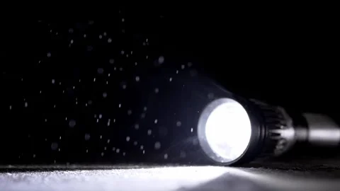 Bright Flashlight Beam Illuminating Dust Particles In Dark Room 库存影片 330116068