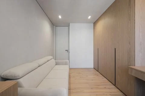 Bright flat interior with sofa and closet Stock Photos