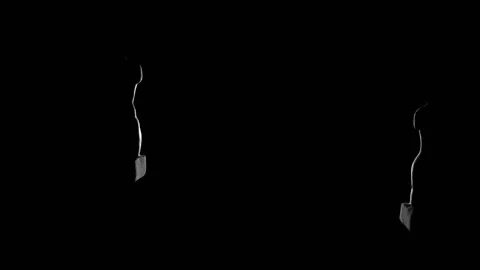 Bright flickering white rays snatch out from the darkness the naked torsos of a Stock Footage 155529733