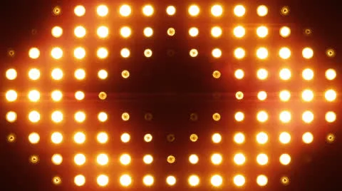 Bright Floodlights Flashing forming figures with sound. Amber. Stock Footage