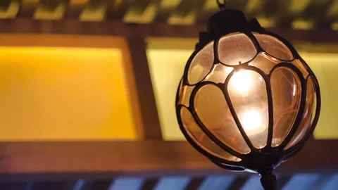 Bright forged lantern with a burning matte lamp inside in the interior Stock Footage 77575033