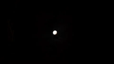 Bright full moon in the dark of the night among clouds and city wires in 4k Video stock 196730566