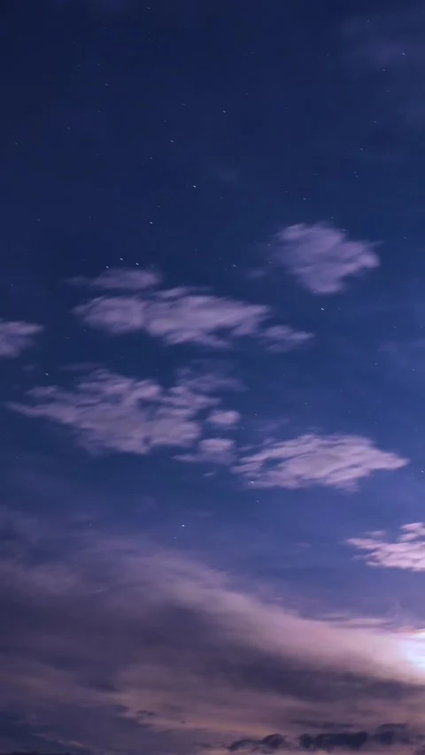 Bright full moon illuminating textured altocumulus clouds at night, timelapse Video stock 341375459