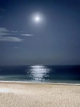 Bright full moon over a tranquil beach Stock Photos