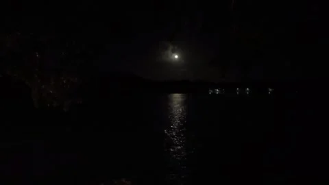Bright full moon view from a beachfront bungalow Stock Footage 321260318