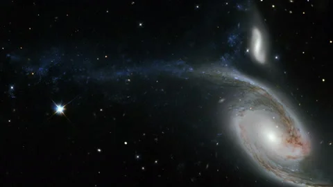 Bright galaxy with long trails of cosmic dust and stars Stock Footage 154436727