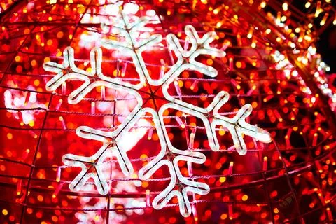 Bright garland in shape of snowflake. Stock Photos