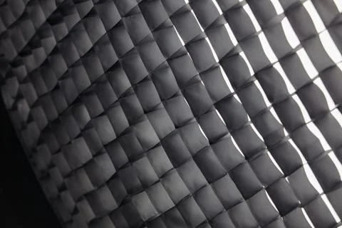 Bright geometric background pattern of a photography softbox honeycomb grid.. 스톡 사진