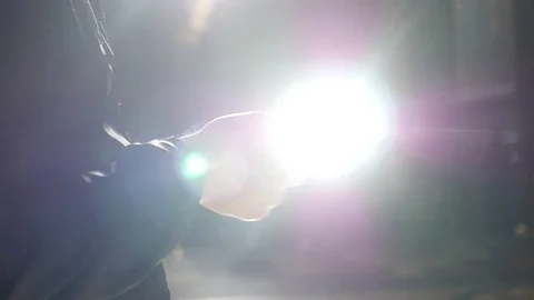 Bright glare from the sun reflected from the phone monitor in the man in the Stock Footage 78973298