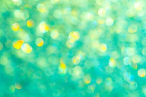 Bright glitter background: bokeh effect from many colored lights on frozen gl Stock Photos