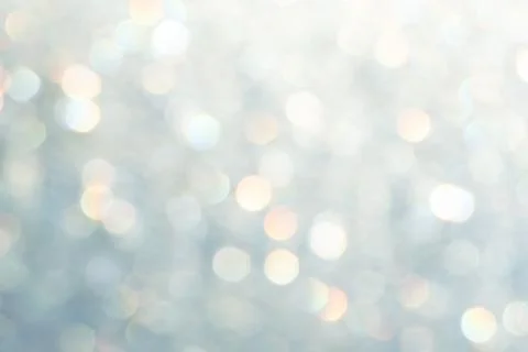 Bright glitter background: bokeh effect from many colored lights on frozen gl Stock Photos