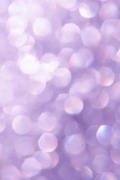 Bright glitter background: bokeh effect from many colored lights on frozen gl Stock Photos