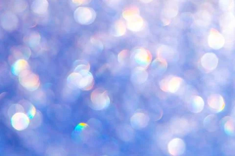 Bright glitter background: bokeh effect from many colored lights on frozen gl Stock Photos