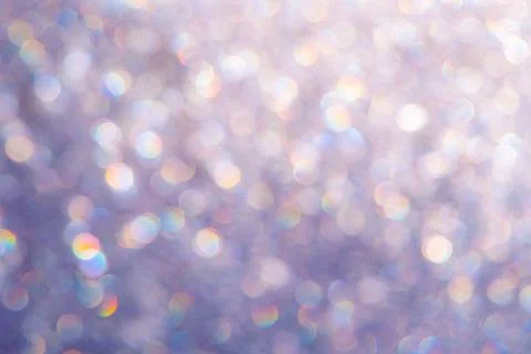 Bright glitter background: bokeh effect from many colored lights on frozen gl Stock Photos