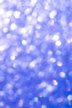 Bright glitter background: bokeh effect from many colored lights on frozen gl Stock Photos