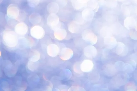 Bright glitter background: bokeh effect from many colored lights on frozen gl Stock Photos