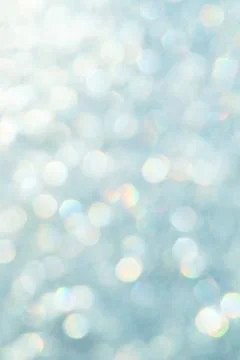 Bright glitter background: bokeh effect from many colored lights on frozen gl Stock Photos