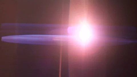 The bright glowing on the dark background. anamorphic lens flare Stock Footage 81046757