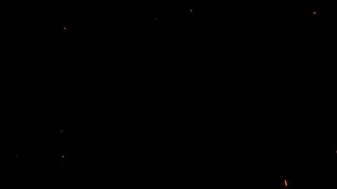 Bright glowing fire particles rising fast in a fiery sky with smoke Stockbeeldmateriaal 302205893
