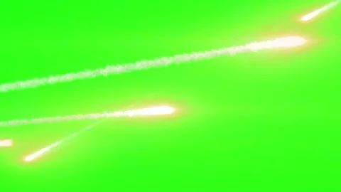 Bright glowing meteor trails moving across a solid green screen background Vídeo Stock 345627246