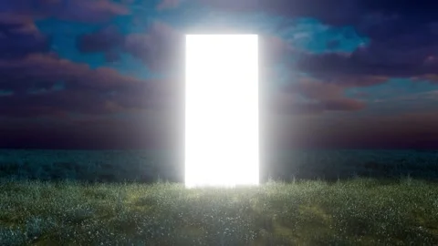 Bright glowing rectangular doorway appearing in a field at dusk Stockbeeldmateriaal 310793253