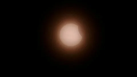 Bright glowing solar eclipse with moon shadow passing in front of sun event 2025 Stock Footage 305662879