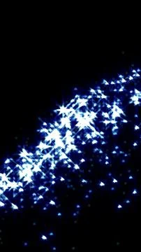 Bright glowing star clusters forming a diagonal pattern over a deep dark ba.. イラスト素材