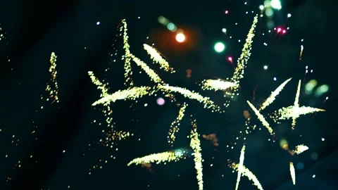 Bright golden and multicolored firework explosions illuminating the night s.. Video stock 343690620