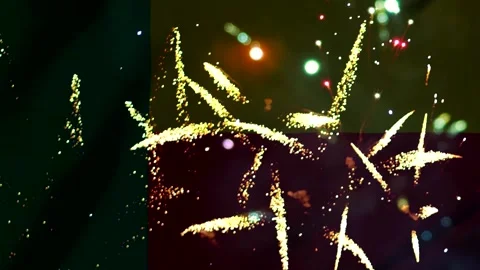Bright golden festive fireworks exploding in the night sky during a celebrati Stock Footage 343690683