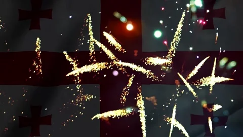 Bright golden fireworks display exploding over the national flag of georgia Video stock 343690699