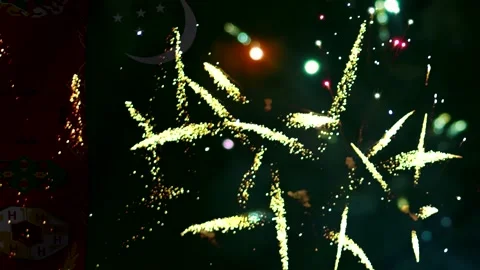 Bright golden fireworks display illuminating the night sky with light trail.. Video stock 343690708