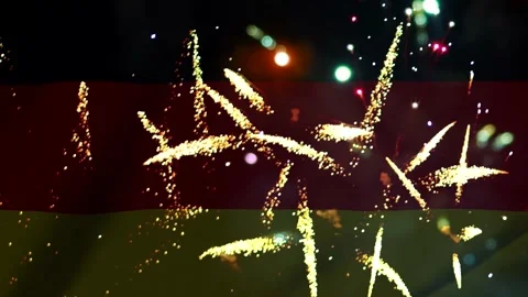 Bright golden fireworks exploding against the national flag of the country .. Vídeos de archivo 343690734