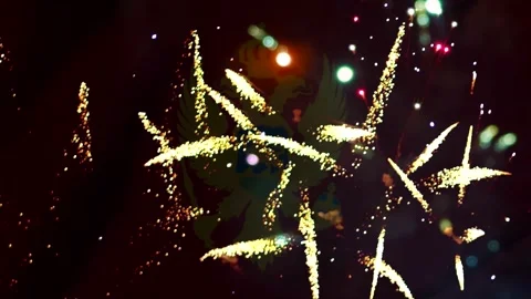 Bright golden fireworks exploding in the night sky behind the national coat.. 库存影片 343690766