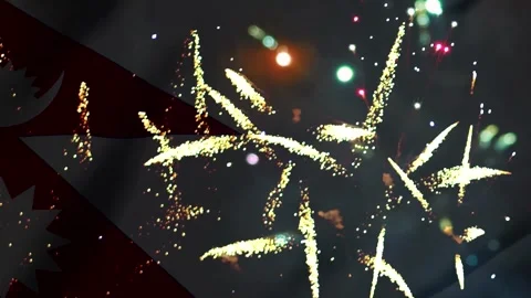 Bright golden fireworks exploding in the night sky behind the national flag.. Vídeos de archivo 343690769