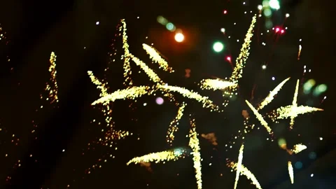 Bright golden fireworks exploding in the night sky during a celebration Vídeos de archivo 343690775
