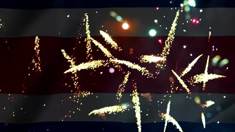 Bright golden fireworks exploding in the night sky over the flag of Costa Ric Video stock 343690788