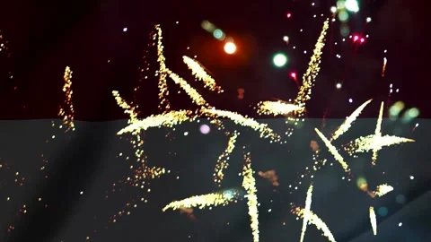 Bright golden fireworks exploding in the night sky over the flag of Monaco Stock Footage 343690794