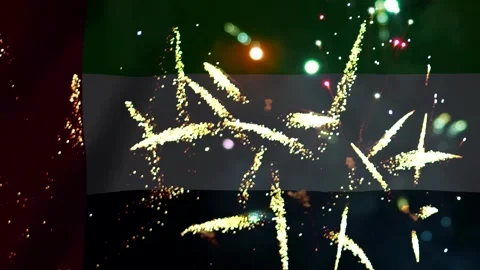 Bright golden fireworks exploding in the night sky over the flag of the Uni.. Video stock 343690806