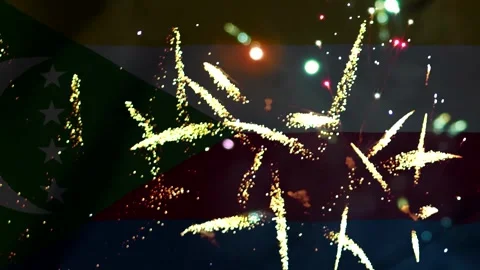 Bright golden fireworks exploding in the night sky over the national flag o.. Video stock 343690822