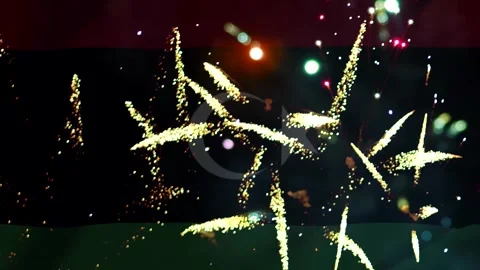 Bright golden fireworks exploding in the night sky over the national flag o.. Video stock 343690853