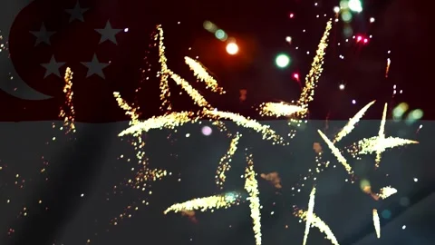 Bright golden fireworks exploding in the night sky over the national flag o.. Stock Footage 343690867