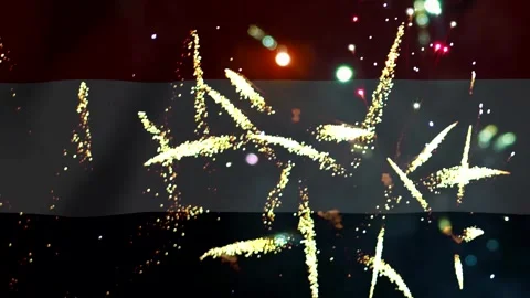 Bright golden fireworks exploding in the night sky over the national flag o.. Video stock 343690889