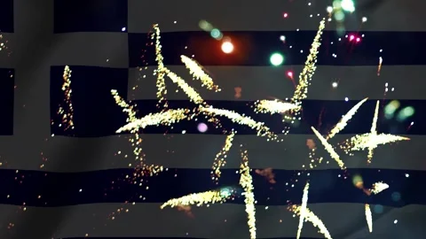 Bright golden fireworks exploding in the night sky over the waving national.. Видео 343690890