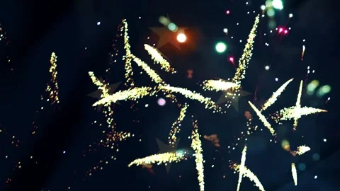 Bright golden fireworks exploding in the night sky with decorative star sha.. Video stock 343690899