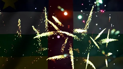 Bright golden fireworks exploding over the central african republic flag ba.. Video stock 343690903