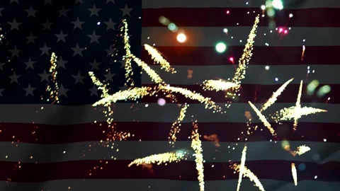 Bright golden fireworks exploding over the waving american flag background .. Видео 343690998